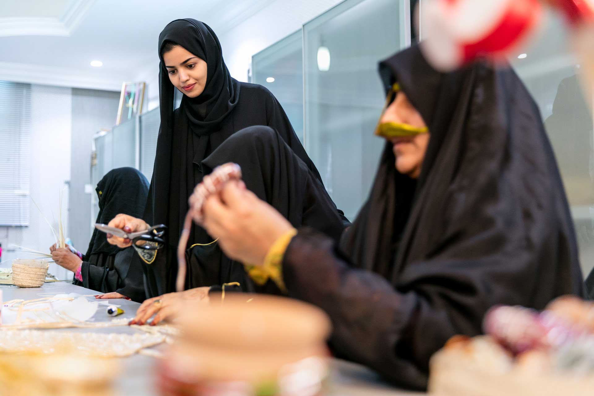 Woman at work at the Al Ghadeer UAE Crafts centre